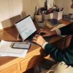 Small business owner using AI on a laptop to save time